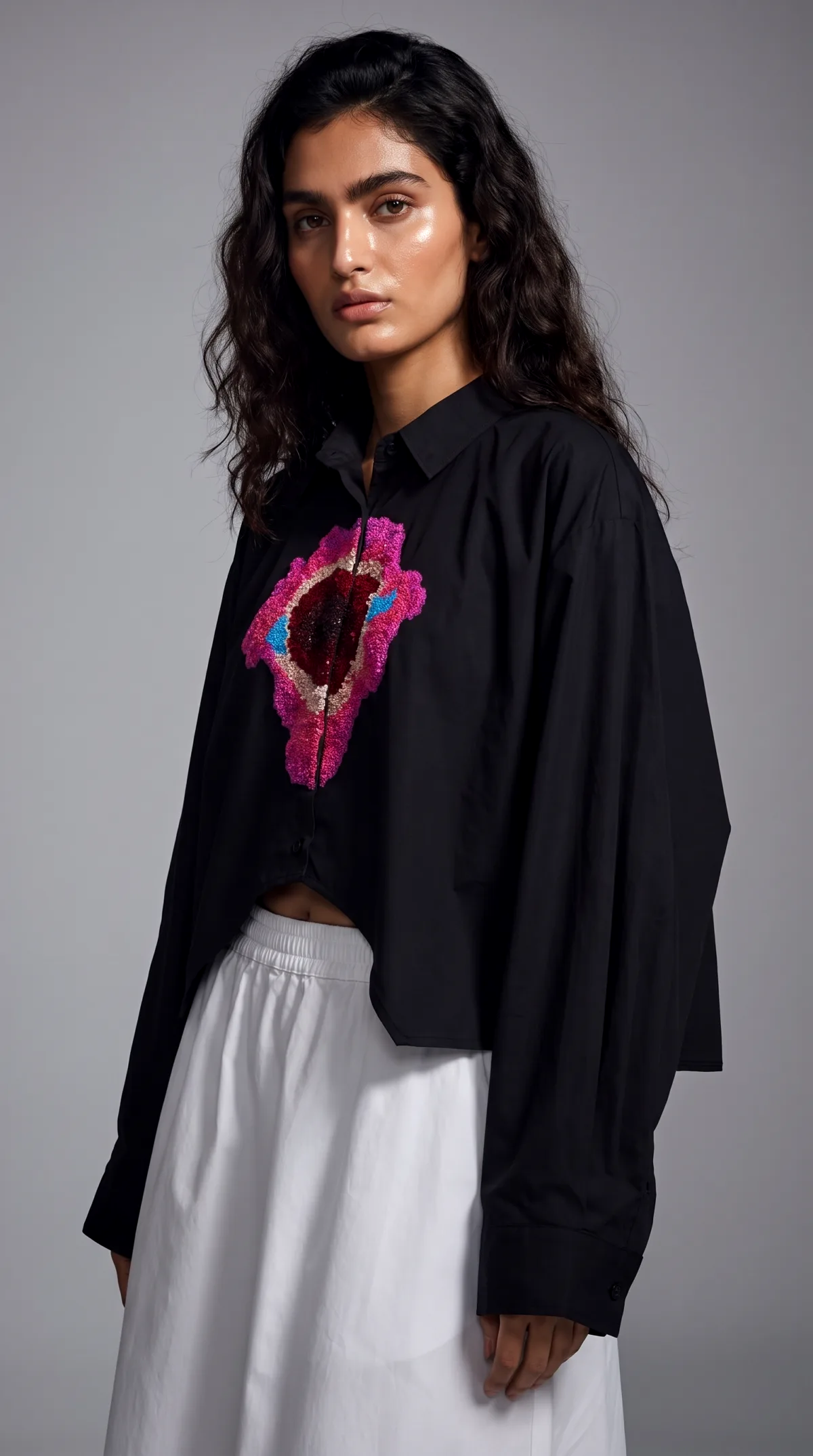 AI generated product photo of an embroidered shirt on a grey studio background