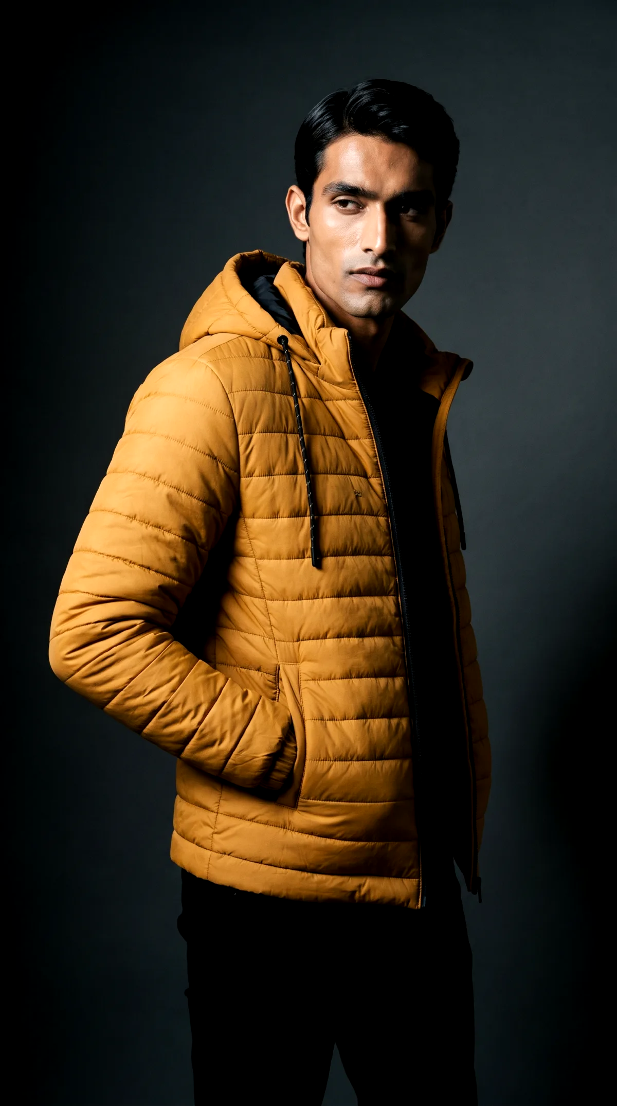 AI generated photoshoot of the same mustard puffer jacket in a dark studio setting