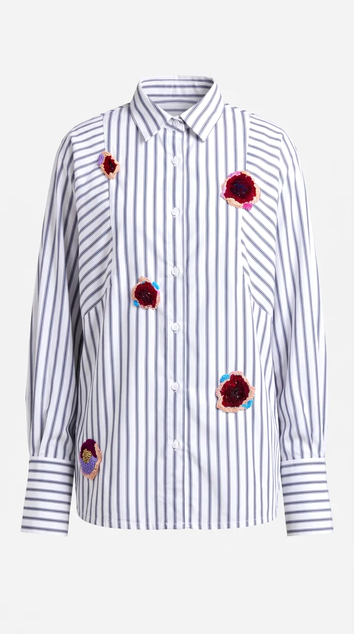 Front of the striped shirt on a ghost mannequin, with five raised flower patches and deep turned-back cuffs